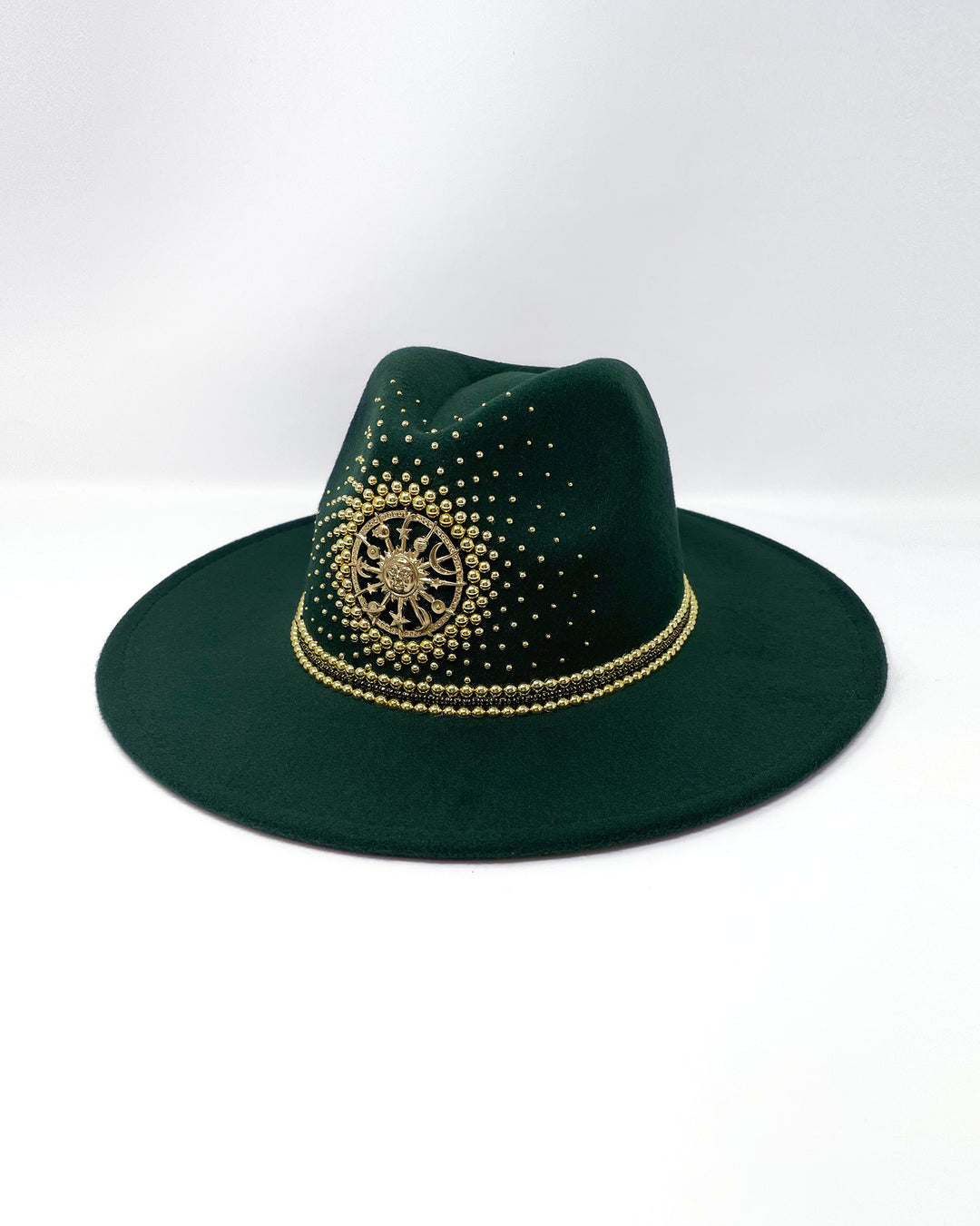 Forest Green Fedora. Gold sun and moon centre motif design, hand embellished with a gold pearl scatter. crystal and gold rhinestone band. ladies day hat, festival hat, boho, wide brim, moss green, wool hat , designer hat, festival hat, best fedora hat brand, festival fashion, hand embellished, made in the UK, ethical fashion brand, custom fedora, festival essentials, felt hat, statement hat, classic fedora, festival outfit inspiration, unique fashion