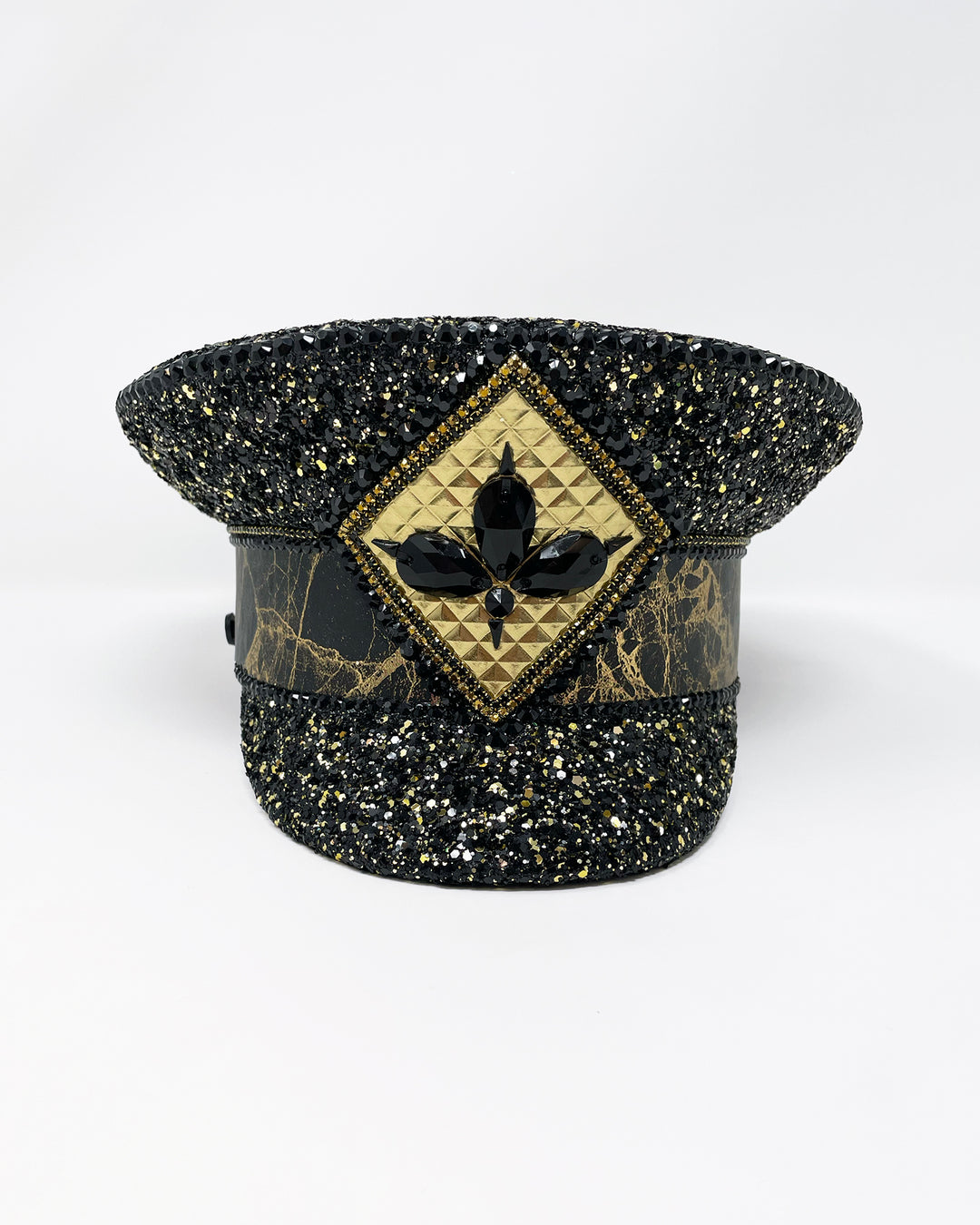 Authentic up cycled military captain hat, fully lined, hand embellished with black and gold glitter mix, beautifully hand detailed with gold and brown marble effect faux leather, gold leatherette, crystals and rhinestones. costume hat, festival hat, festival outfit, statement hat, high end hats, high end party wear, where to buy captain hats, stage wear, unique fashion, custom stage wear, festival essentials, festival headwear, halloween outfit, burning man hat, army hat, made in the UK