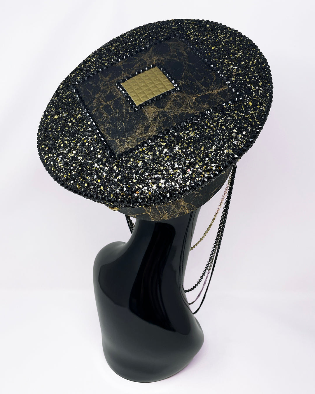 Authentic up cycled military captain hat, fully lined, hand embellished with black and gold glitter mix, beautifully hand detailed with gold and brown marble effect faux leather, gold leatherette, crystals and rhinestones. costume hat, festival hat, festival outfit, statement hat, high end hats, high end party wear, where to buy captain hats, stage wear, unique fashion, custom stage wear, festival essentials, festival headwear, halloween outfit, burning man hat, army hat, made in the UK