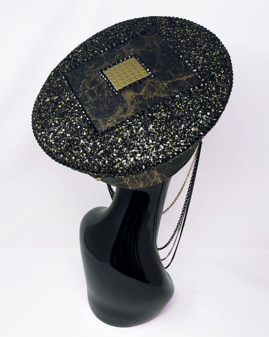 Authentic up cycled military captain hat, fully lined, hand embellished with black and gold glitter mix, beautifully hand detailed with gold and brown marble effect faux leather, gold leatherette, crystals and rhinestones. costume hat, festival hat, festival outfit, statement hat, high end hats, high end party wear, where to buy captain hats, stage wear, unique fashion, custom stage wear, festival essentials, festival headwear, halloween outfit, burning man hat, army hat, made in the UK