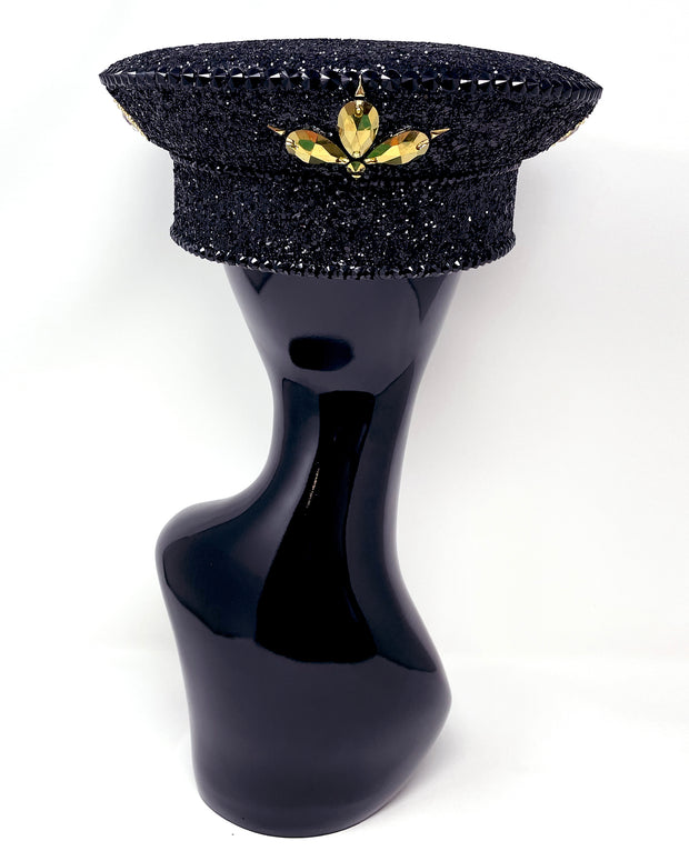 Black and gold Captain hat. Authentic up cycled military hat, fully lined, hand embellished with black glitter, beautifully hand detailed with gold faux leather, clasped crystals and gold pearl like rhinestones. costume hat, festival hat, festival outfit, statement hat, high end hats, high end party wear, where to buy captain hats, stage wear, unique fashion, custom stagewear, festival essentials, festival headwear, halloween outfit