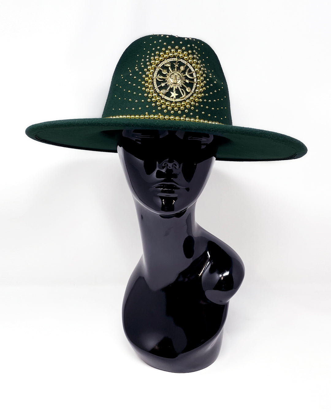 Forest Green Fedora. Gold sun and moon centre motif design,  hand embellished with a gold pearl scatter. crystal and gold rhinestone band. ladies day hat, festival hat, boho, wide brim, moss green, wool hat , designer hat, festival hat, best fedora hat brand, festival fashion, hand embellished, made in the UK, ethical fashion brand, custom fedora, festival essentials, felt hat, statement hat, classic fedora, festival outfit inspiration, unique fashion