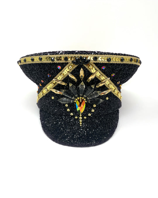 Black and Gold captain hat. Authentic up cycled military hat, fully lined, hand embellished with black glitter mix. Black gold flip sequin top, hand detailed with sequin trim, crystals and rhinestones. costume hat, festival hat, festival outfit, statement hat, high end hats, high end party wear, where to buy captain hats, stage wear, unique fashion, festival essentials, festival headwear, halloween, burning man hat, army hat, rave outfit, festival style, unique fashion, mermaid sequin, hats for rent