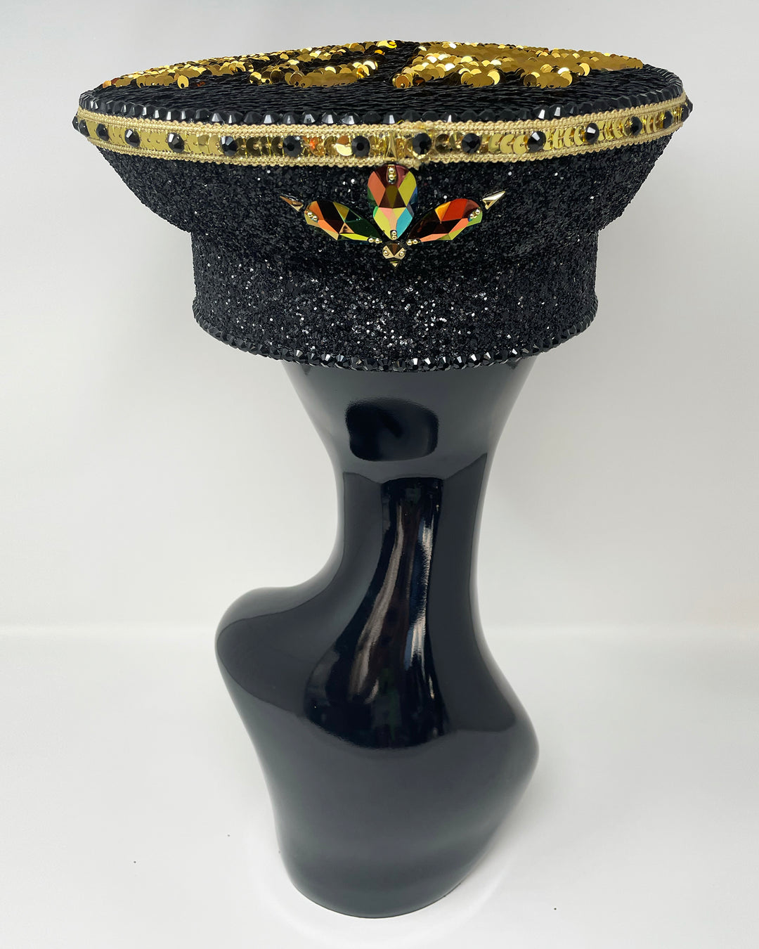 Black and Gold captain hat. Authentic up cycled military hat, fully lined, hand embellished with black glitter mix. Black gold flip sequin top, hand detailed with sequin trim, crystals and rhinestones. costume hat, festival hat, festival outfit, statement hat, high end hats, high end party wear, where to buy captain hats, stage wear, unique fashion, festival essentials, festival headwear, halloween, burning man hat, army hat, rave outfit, festival style, unique fashion, mermaid sequin, hats for rent
