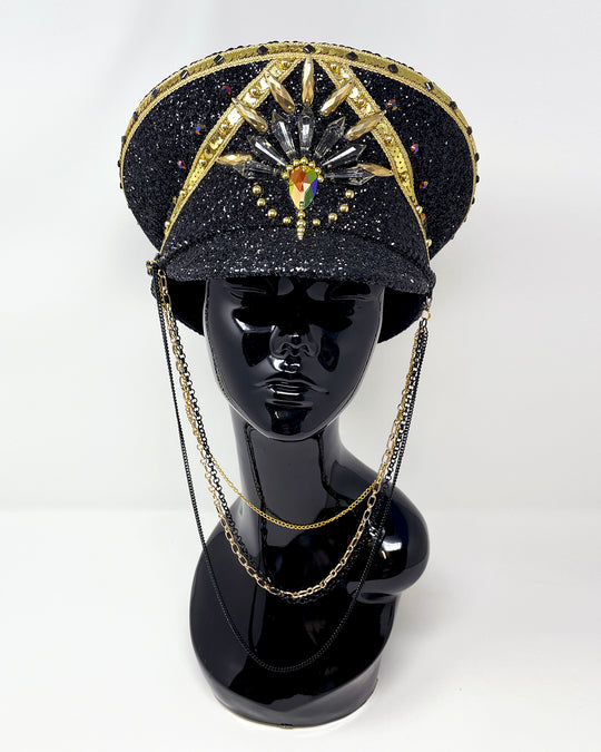 Black and Gold captain hat. Authentic up cycled military hat, fully lined, hand embellished with black glitter mix. Black gold flip sequin top, hand detailed with sequin trim, crystals and rhinestones. costume hat, festival hat, festival outfit, statement hat, high end hats, high end party wear, where to buy captain hats, stage wear, unique fashion, festival essentials, festival headwear, halloween, burning man hat, army hat, rave outfit, festival style, unique fashion, mermaid sequin, hats for rent