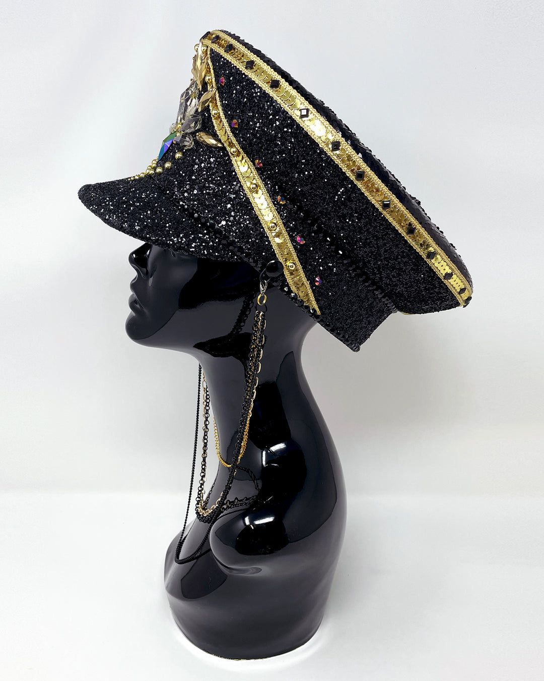 Black and Gold captain hat. Authentic up cycled military hat, fully lined, hand embellished with black glitter mix. Black gold flip sequin top, hand detailed with sequin trim, crystals and rhinestones. costume hat, festival hat, festival outfit, statement hat, high end hats, high end party wear, where to buy captain hats, stage wear, unique fashion, festival essentials, festival headwear, halloween, burning man hat, army hat, rave outfit, festival style, unique fashion, mermaid sequin, hats for rent