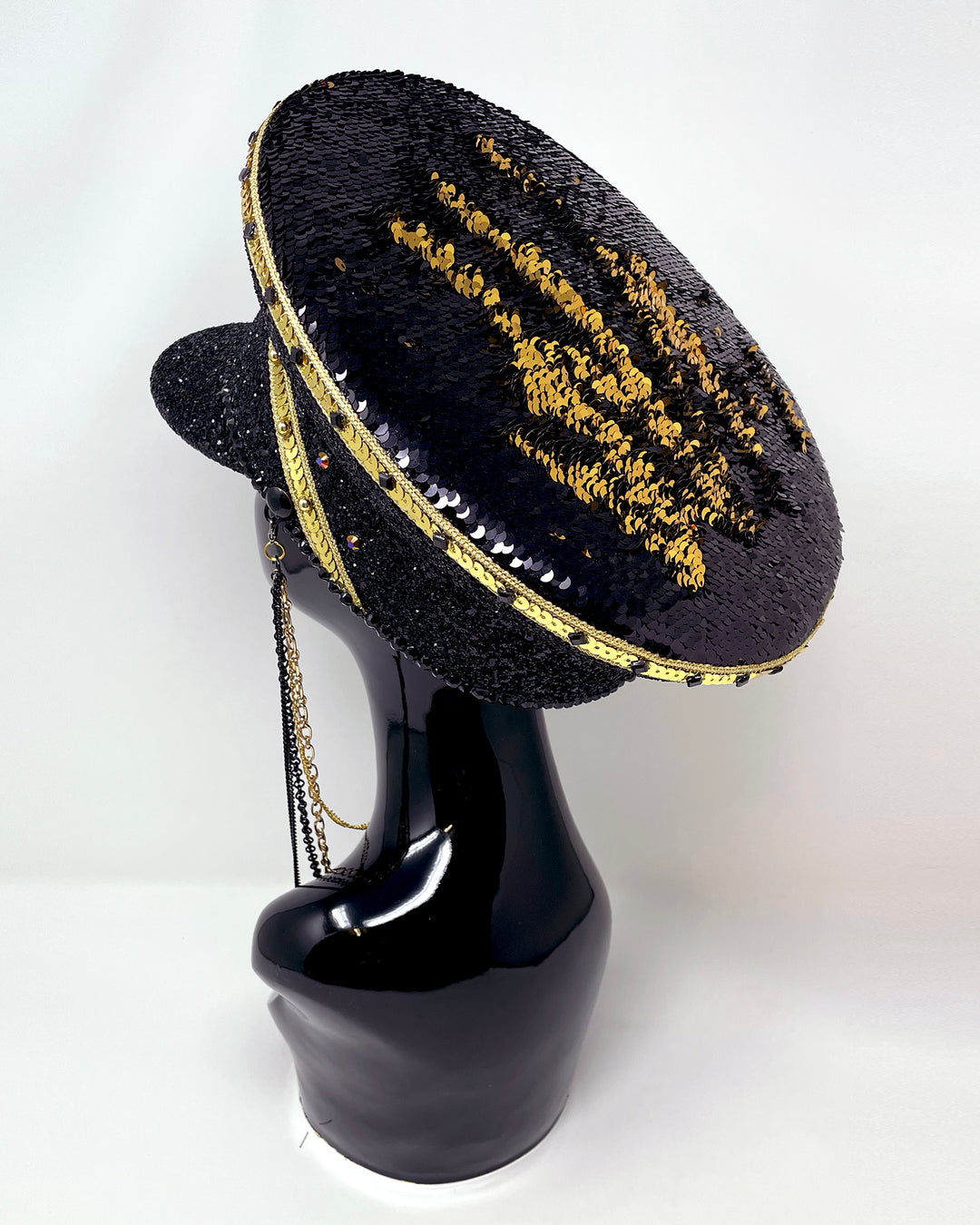 Black and Gold captain hat. Authentic up cycled military hat, fully lined, hand embellished with black glitter mix. Black gold flip sequin top, hand detailed with sequin trim, crystals and rhinestones. costume hat, festival hat, festival outfit, statement hat, high end hats, high end party wear, where to buy captain hats, stage wear, unique fashion, festival essentials, festival headwear, halloween, burning man hat, army hat, rave outfit, festival style, unique fashion, mermaid sequin, hats for rent