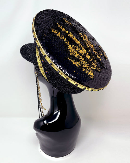 Black and Gold captain hat. Authentic up cycled military hat, fully lined, hand embellished with black glitter mix. Black gold flip sequin top, hand detailed with sequin trim, crystals and rhinestones. costume hat, festival hat, festival outfit, statement hat, high end hats, high end party wear, where to buy captain hats, stage wear, unique fashion, festival essentials, festival headwear, halloween, burning man hat, army hat, rave outfit, festival style, unique fashion, mermaid sequin, hats for rent