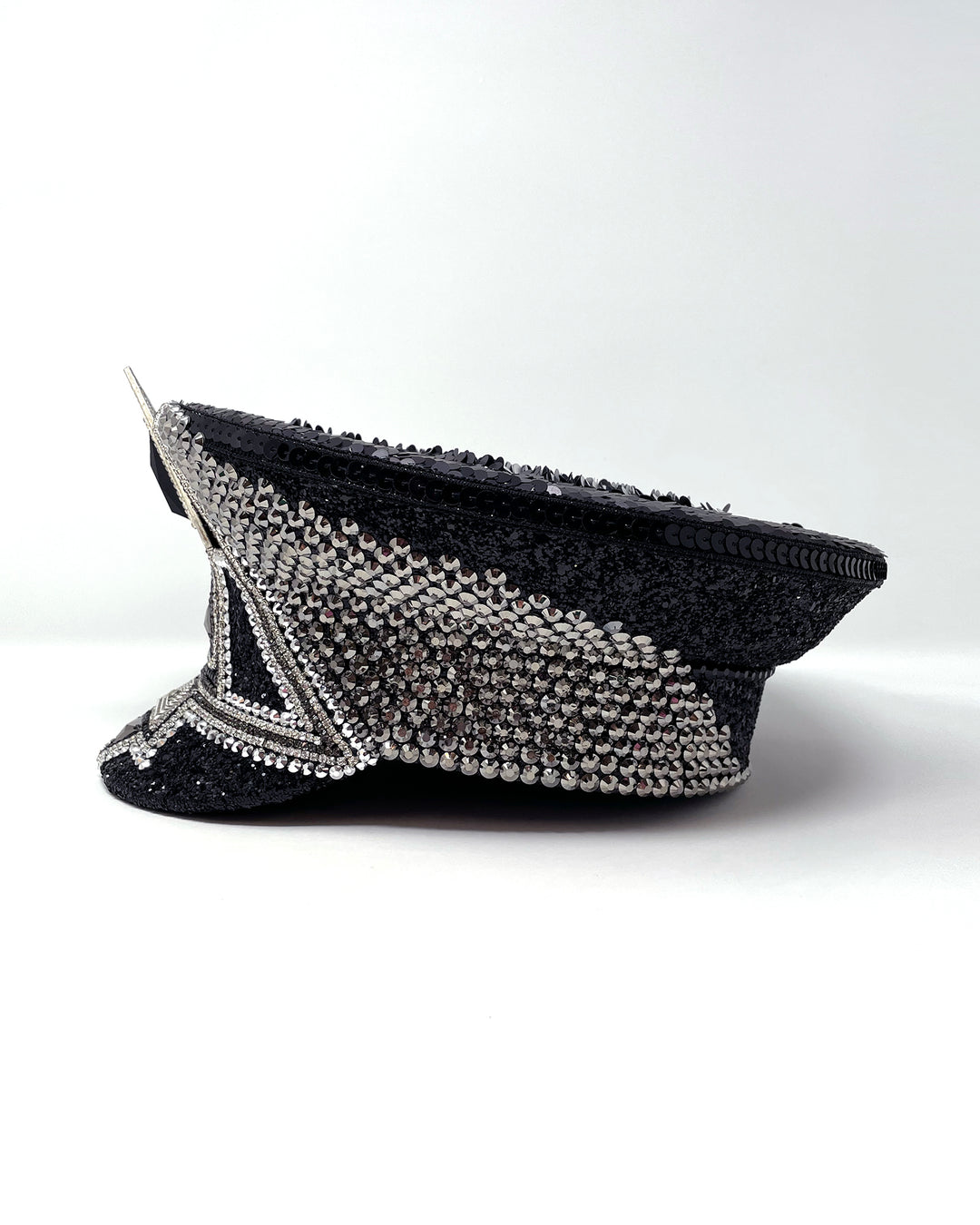Black and silver Bermuda captain hat. Authentic up cycled military hat embellished with glitter, silver motive and rhinestones. Stage wear, rave outfit, costume hat, sequin hat, festival wear, statement hat, unique festival hat, handmade hat, costume hat, reworked, best captain hats, army hat, handmade in the UK, high end hat, high end party, halloween hat, halloween outfit, festival fashion, festival style, festival outfit
