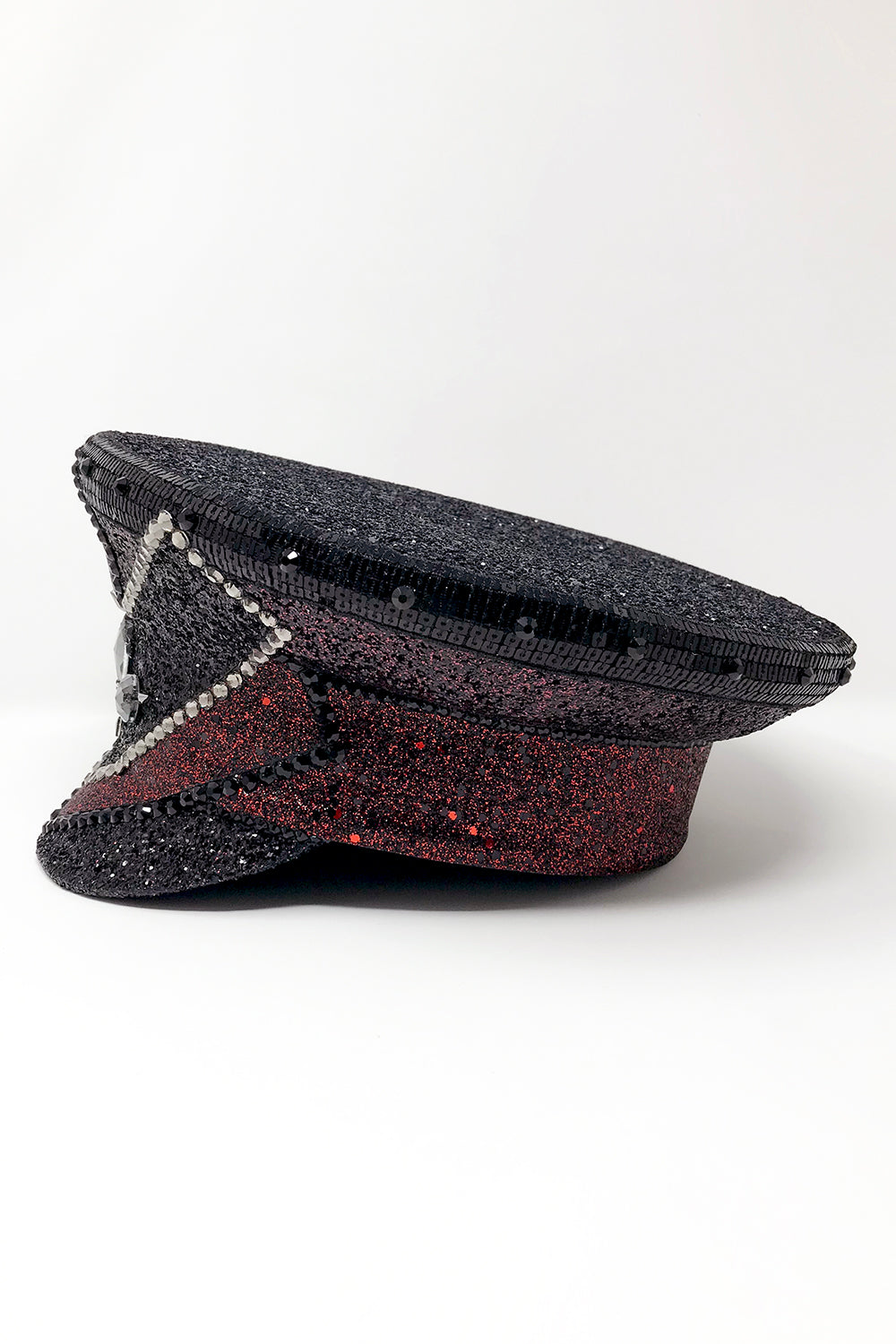Black and red captain hat, Authentic up cycled military hat, fully lined, hand embellished with black and red glitter mix, beautifully hand detailed with black and red glitter faux leather, square sequin trim, crystals and rhinestones. costume hat, festival hat, festival outfit, statement hat, high end hats, high end party wear, where to buy captain hats, stage wear, unique fashion, custom stagewear, festival essentials, festival headwear, halloween outfit, burning man hat, army hat, made in the UK, rave