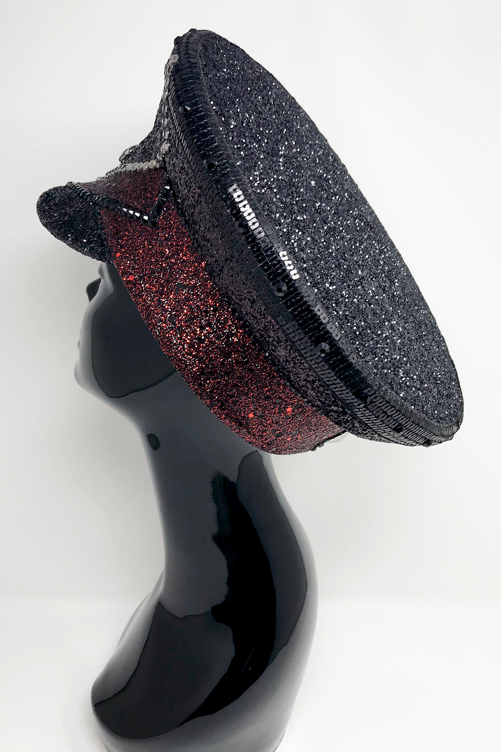 Black and red captain hat, Authentic up cycled military hat, fully lined, hand embellished with black and red glitter mix, beautifully hand detailed with black and red glitter faux leather, square sequin trim, crystals and rhinestones. costume hat, festival hat, festival outfit, statement hat, high end hats, high end party wear, where to buy captain hats, stage wear, unique fashion, custom stagewear, festival essentials, festival headwear, halloween outfit, burning man hat, army hat, made in the UK, rave