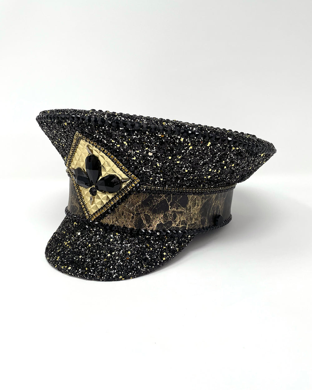 Authentic up cycled military captain hat, fully lined, hand embellished with black and gold glitter mix, beautifully hand detailed with gold and brown marble effect faux leather, gold leatherette, crystals and rhinestones. costume hat, festival hat, festival outfit, statement hat, high end hats, high end party wear, where to buy captain hats, stage wear, unique fashion, custom stagewear, festival essentials, festival headwear, halloween outfit, burning man hat, army hat, made in the UK