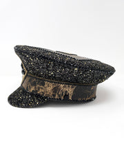Authentic up cycled military captain hat, fully lined, hand embellished with black and gold glitter mix, beautifully hand detailed with gold and brown marble effect faux leather, gold leatherette, crystals and rhinestones. costume hat, festival hat, festival outfit, statement hat, high end hats, high end party wear, where to buy captain hats, stage wear, unique fashion, custom stagewear, festival essentials, festival headwear, halloween outfit, burning man hat, army hat, made in the UK