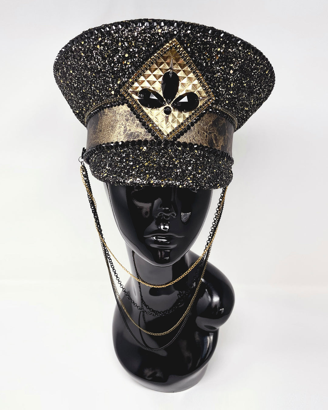 Authentic up cycled military captain hat, fully lined, hand embellished with black and gold glitter mix, beautifully hand detailed with gold and brown marble effect faux leather, gold leatherette, crystals and rhinestones. costume hat, festival hat, festival outfit, statement hat, high end hats, high end party wear, where to buy captain hats, stage wear, unique fashion, custom stagewear, festival essentials, festival headwear, halloween outfit, burning man hat, army hat, made in the UK
